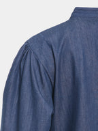 Gathered shoulder detail and denim texture on blue abaya