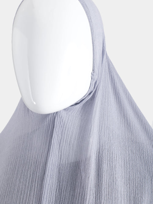Close-up of the elasticated face-opening on the Lavender Instant Hijab, showing the flexible seam and modal cotton grain.