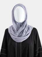 Lavender Instant Modal Cotton Hijab styled with a wrapped chest drape to demonstrate the pin-free, hand-wrapped aesthetic.