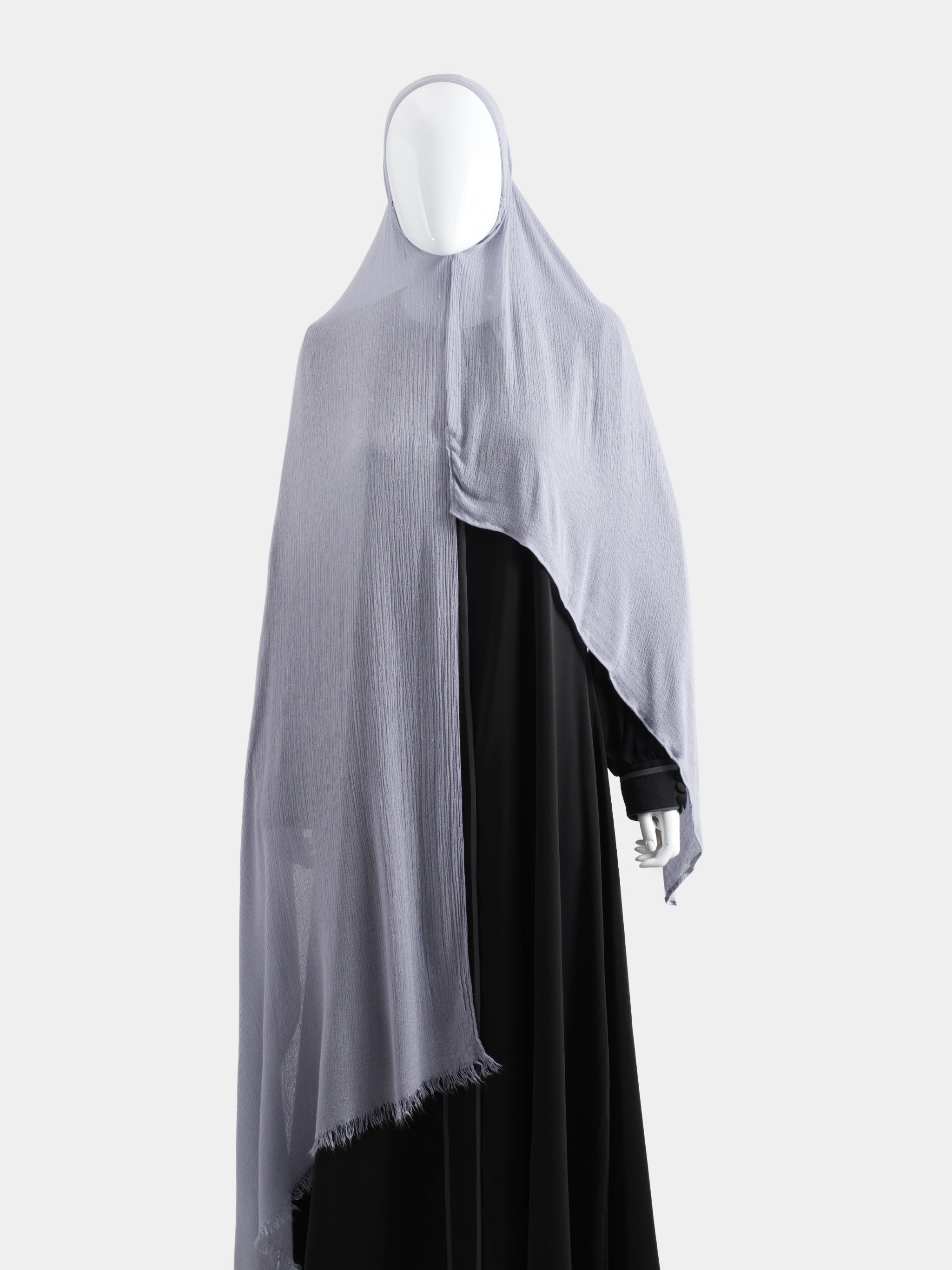 Full-length view of the Lavender Instant Hijab over a black abaya, showing 100% opaque coverage and the flow of the modal fabric.