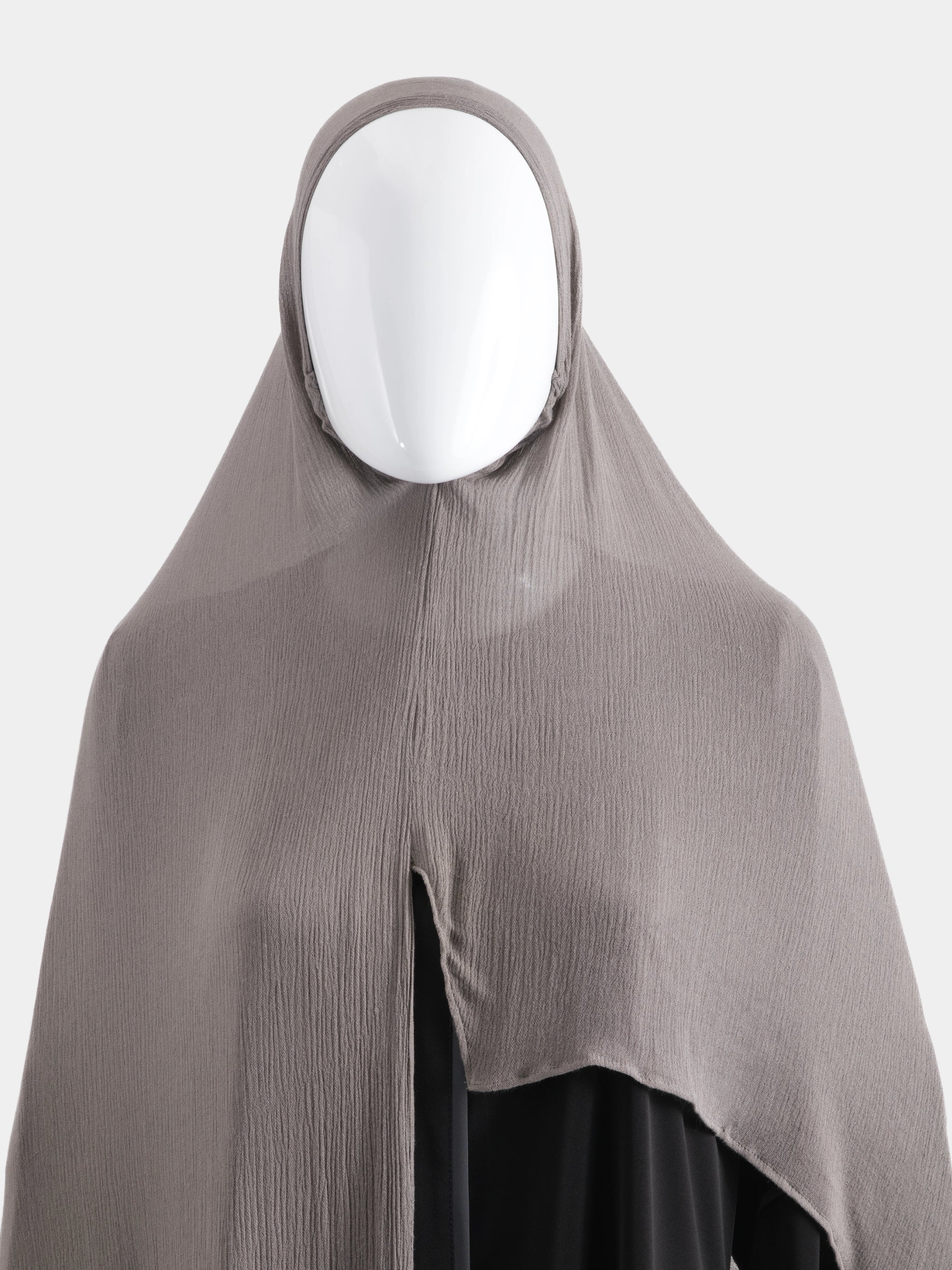 Flat lay of the Instant Modal Cotton Hijab in Taupe showing the pre-stitched front slit and textured weave.