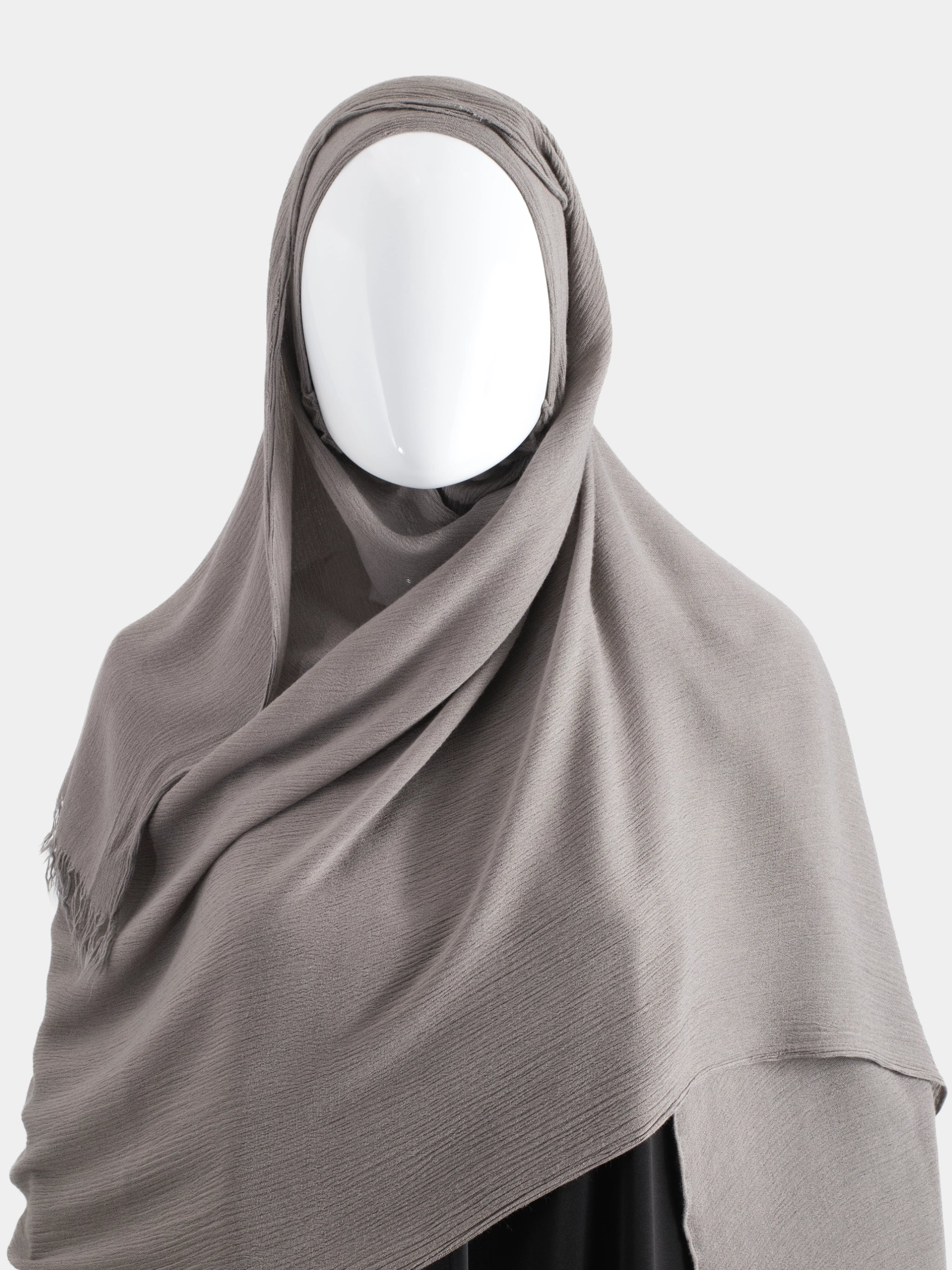 Side profile of the Taupe Instant Modal Cotton Hijab showing the contoured fit and pin-free styling.