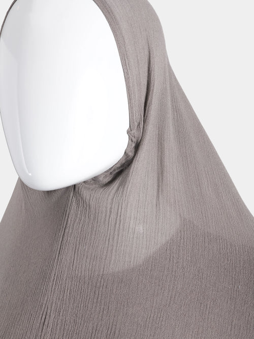 Close-up detail of the elasticated face-frame on the Taupe Instant Hijab, highlighting the high-friction modal cotton texture.