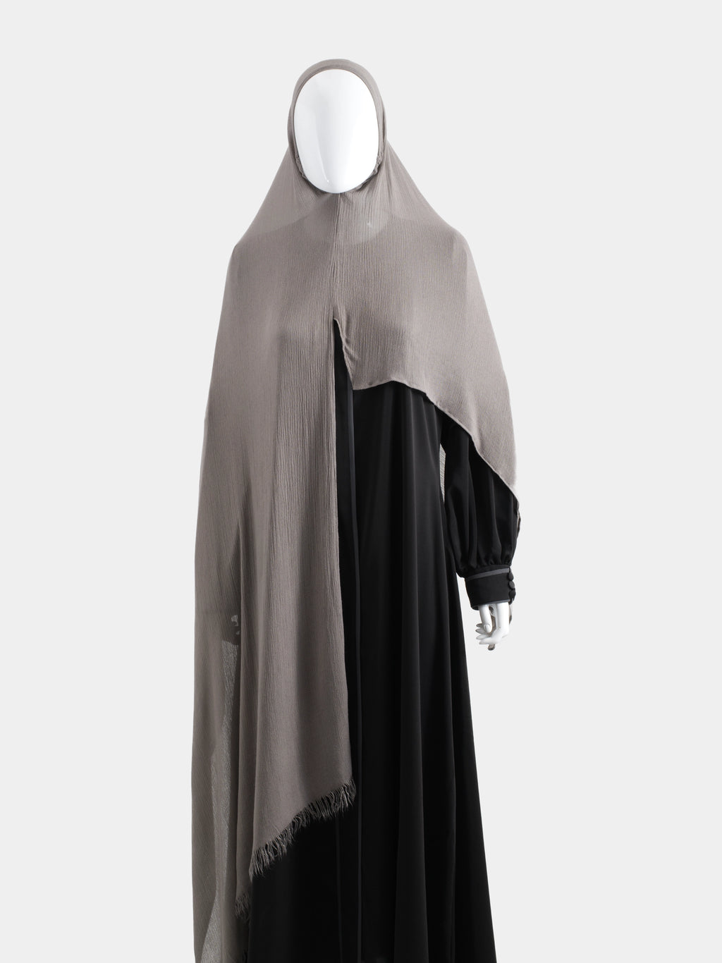 Full-length view of the Taupe Instant Hijab paired with a black abaya, demonstrating the 100% opaque drape and shoulder coverage.