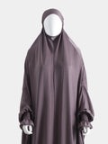 Dark purple jilbab on a mannequin against a white background