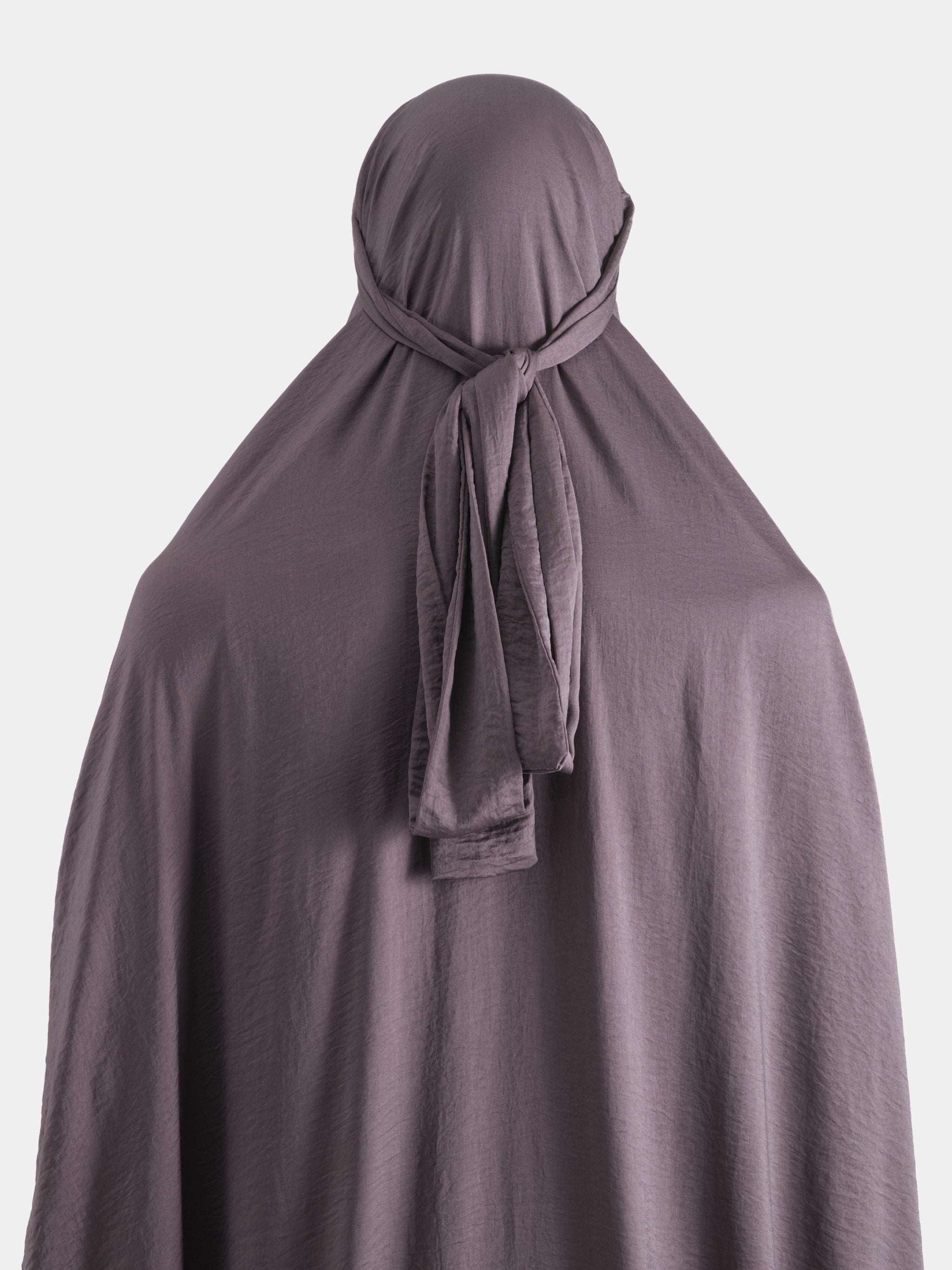 Purple jilbab with a tie-back on a white background