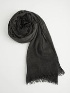 Black crinkle scarf with frayed edges on a white background